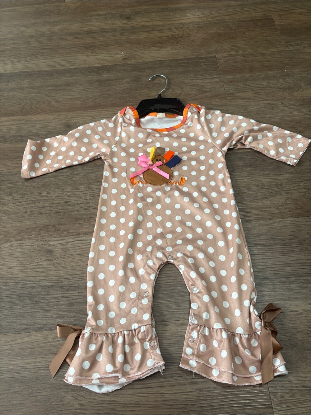 100% Pure Pink Polka Dot Ruffle Footie Romper with Bow Accents